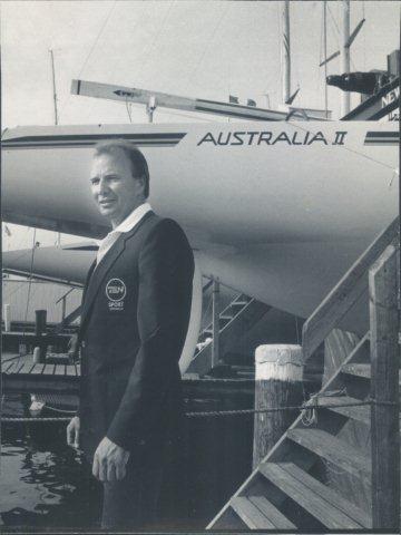 Rob Mundle with Australia II in his Channel 7 broadcasting jacket - photo © Archive