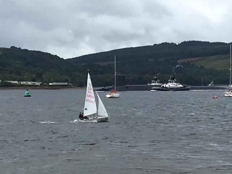 A submarine slips silently past the fleet during the Sailingfast 420 National Championship at Helensburgh photo copyright Mike Cattermole taken at Helensburgh Sailing Club and featuring the 420 class