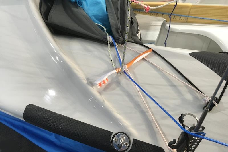 The elestic-mounted toothbrush keeps the spinnaker halyard in check when the sail is stowed photo copyright Magnus Smith taken at RYA Dinghy Show and featuring the 420 class
