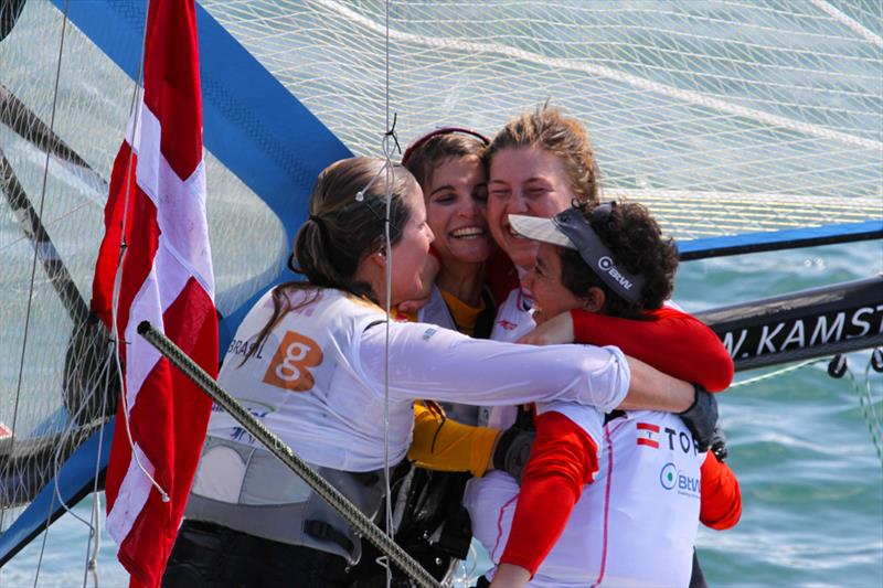 Gold and silver in the 49erFX class embrace at the ISAF Sailing World Championship in Santander photo copyright ISAF taken at  and featuring the 49er FX class
