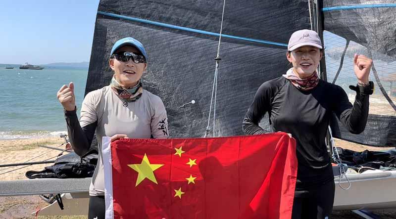 2023 Asian Sailing Championships - 49erFX Chinese Xiaoya Hu and Mengshuan Shan, celebrating gold and a ticket to Paris 2024 photo copyright Nima Chandler taken at Royal Varuna Yacht Club and featuring the 49er FX class