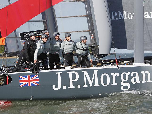 Ben and his team on J.P.Morgan BAR celebrate their fabulous record-breaking achievement right after crossing the line in today's J.P. Morgan Asset Management Round the Island Race photo copyright Patrick Eden taken at  and featuring the AC45 class