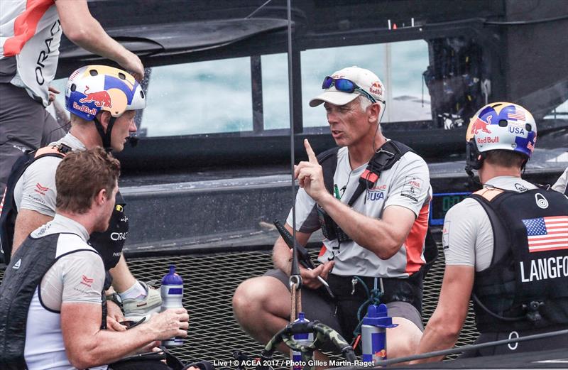 ORACLE TEAM USA Coach Philippe Presti talks to Jimmy Spithill, Tom Slingsby and Kyle Langford on day 3 of the 35th America's Cup Match photo copyright ACEA 2017 / Gilles Martin-Raget taken at  and featuring the AC50 class