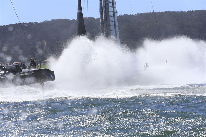 A big splashdown for ORACLE TEAM USA as they round mark 1 during the 34th America's Cup deciding race 19 photo copyright Gilles Martin-Raget / ACEA taken at  and featuring the AC72 class