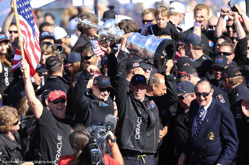 Larry Ellison lifts the America's Cup in San Francisco - photo © Gilles Martin-Raget / ACEA