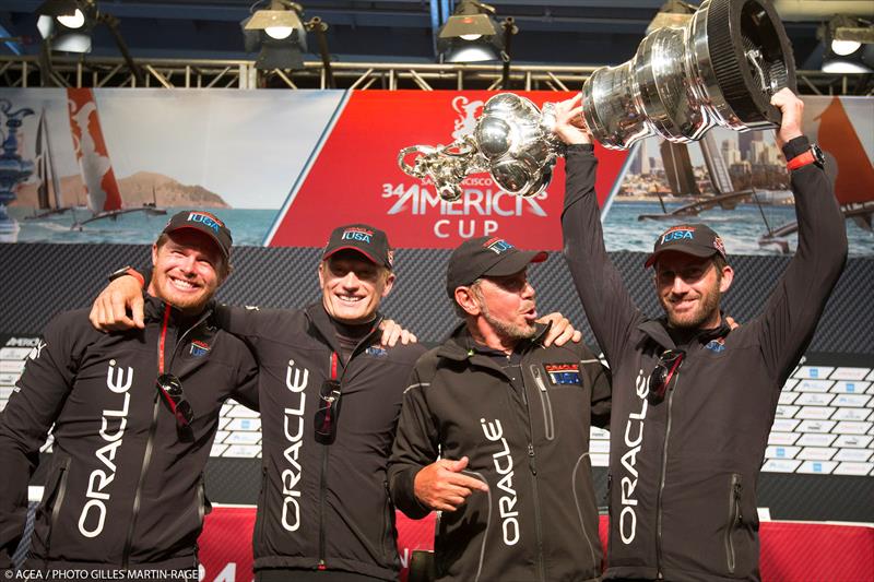 Sir Ben Ainslie lifts the America's Cup - photo © Gilles Martin-Raget / ACEA