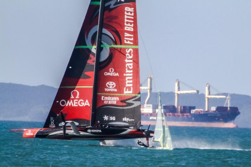 Emirates Team New Zealand dips a 49er sailed by an Austrian crew - October 2019 photo copyright Richard Gladwell taken at Royal New Zealand Yacht Squadron and featuring the AC75 class