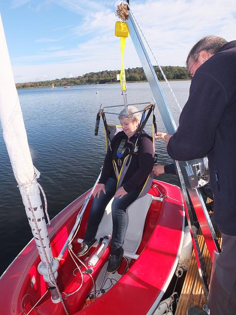 Barbara Wright President of Farnham Lion getting a gentle ride down in the new hoisted into the Hansa 2.3 from the new jetty at Frensham Pond Sailability photo copyright Tony Machen taken at Frensham Pond Sailability and featuring the Hansa class