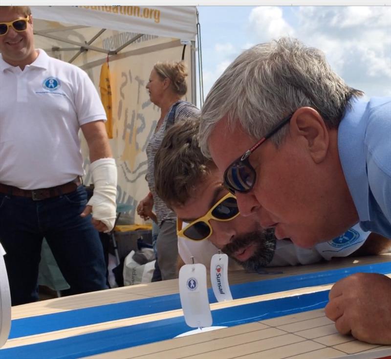 Olympic Gold medalist Ian Percy was literally blown away by Sir Keith Mills in the Gutter Boat Race - photo © BBC Solent