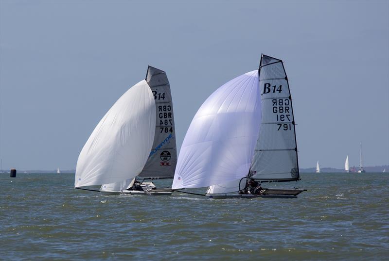 Neil Pryde and Ullman Sails battle for 2nd during the B14 TT at Stokes Bay photo copyright Tim Olin / www.olinphoto.co.uk taken at Stokes Bay Sailing Club and featuring the B14 class