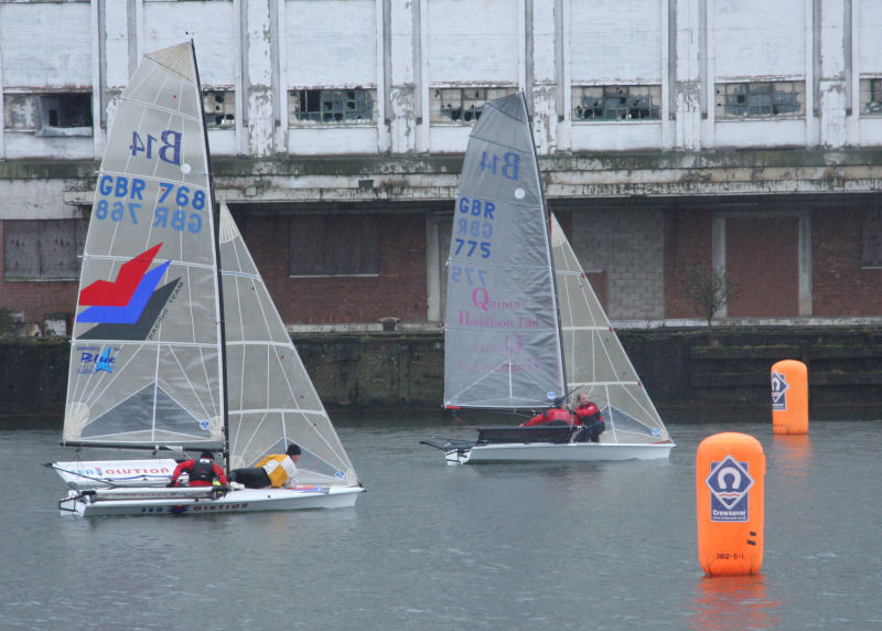 Gusty winds in the confines of the Royal Victoria Dock during the Ovington Skiff Grand Prix photo copyright Mark Jardine / Y&Y taken at  and featuring the B14 class