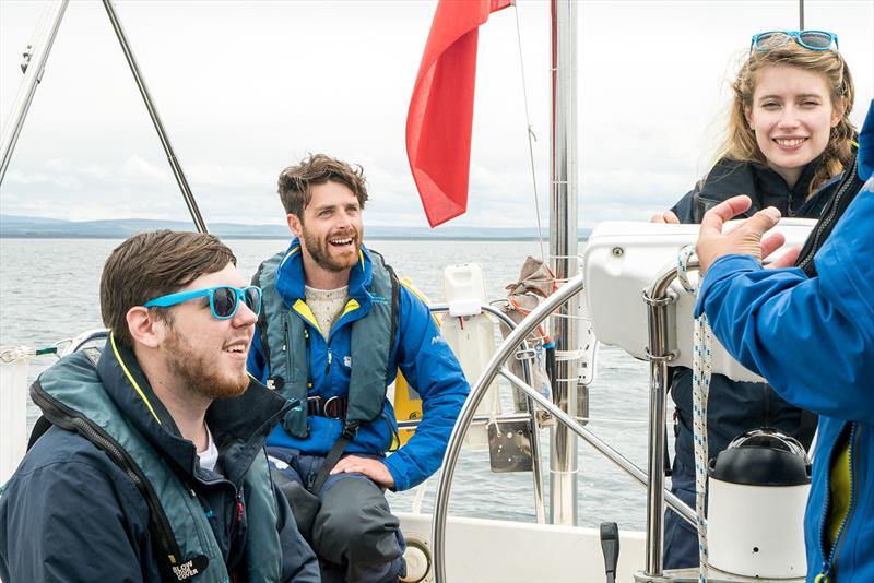 Luke enjoying time on the boat with some of the young people - photo © Ellen MacArthur Cancer Trust