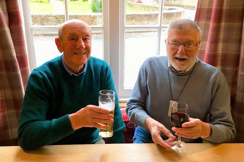 (L-R) Colin Brewer enjoys a drink with life-long friend, boatbuilder and designer John Mullins photo copyright Mullins family taken at Colne Yacht Club and featuring the Brightlingsea One Design class
