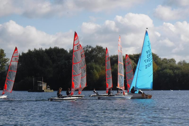 A swarm of Bytes close in on an Enterprise at Frampton on Severn photo copyright Stephen Brooks taken at Frampton on Severn Sailing Club and featuring the Byte class