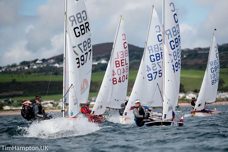 Hazel Whittle and Anna Horakova lead Ami and Ben Goult around a windward mark during the 2017 Cadet Nationals photo copyright Tim Hampton.UK taken at South Caernarvonshire Yacht Club and featuring the Cadet class