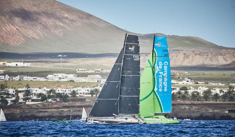 Catherine Pourre's Class40, Eärendil and Miranda Merron and Halvard Mabire's Campagne de France head towards the turning mark off Puerto Calero Marina in the RORC Transatlantic Race photo copyright RORC / James Mitchell taken at  and featuring the Class 40 class