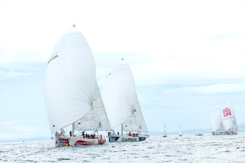 The Clipper yacht Derry-Londonderry-Doire leads Garmin at Greencastle Lough Foyle the start of Race 13 of the Clipper Race - photo © Martin McKeown / Clipper-ventures