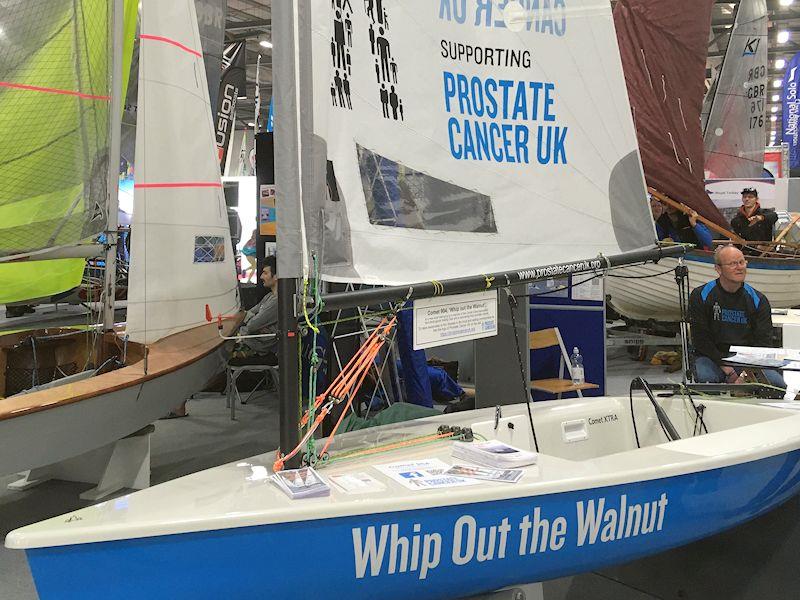 Comet 904 'Whip Out the Walnut' highlights risks of prostate cancer - seen at the RYA Dinghy & Watersports Show photo copyright Magnus Smith / www.yachtsandyachting.com taken at RYA Dinghy Show and featuring the Comet class