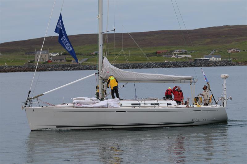 Serenity flying the Blue Ribbon after she crossed the line first at Lerwick at the end of leg 1 of the Bergen Shetland Race photo copyright Espen Sandøy taken at Lerwick Boating Club and featuring the Cruising Yacht class