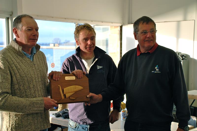 Chairman Gordon Goldstone presents Erling Holmberg and Liam Thom with the OTT Trophy during the Sprint 15 Winter TT at Oxford photo copyright Clive Latham taken at Oxford Sailing Club and featuring the Dart 15 class