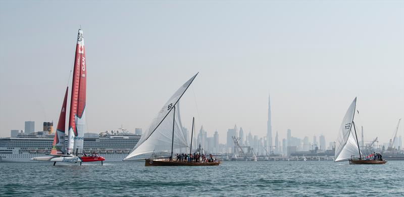 Canada SailGP team F50 sailing past a traditional sailing dhow during a demonstration event ahead of the Dubai Sail Grand Prix presented by P&O Marinas in Dubai, United Arab Emirates photo copyright Ricardo Pinto for SailGP taken at  and featuring the Dhow class