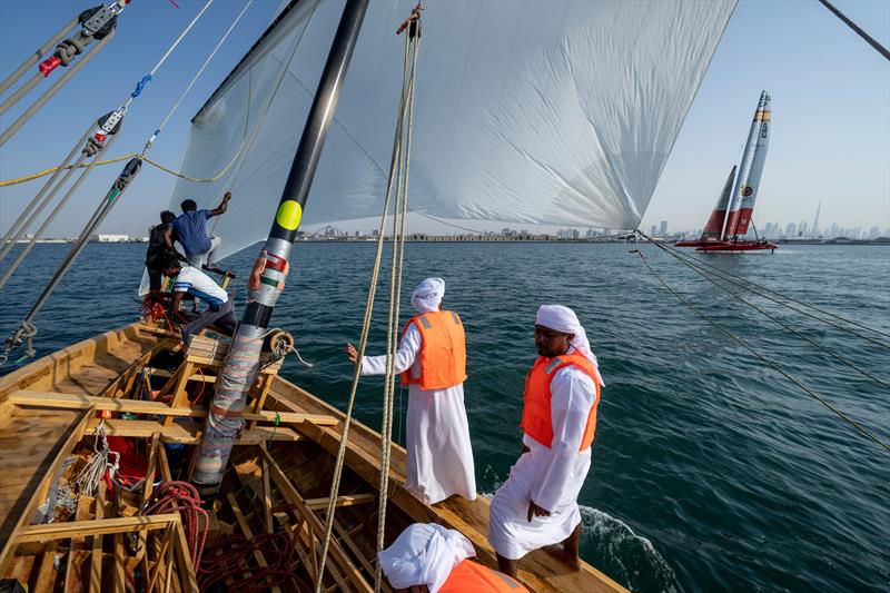 Sailors on board the dhow sailing boat as they sail alongside the Spain SailGP F50 during a demonstration event ahead of the Dubai Sail Grand Prix presented by P&O Marinas in Dubai, United Arab Emirates photo copyright Adam Warner for SailGP taken at  and featuring the Dhow class