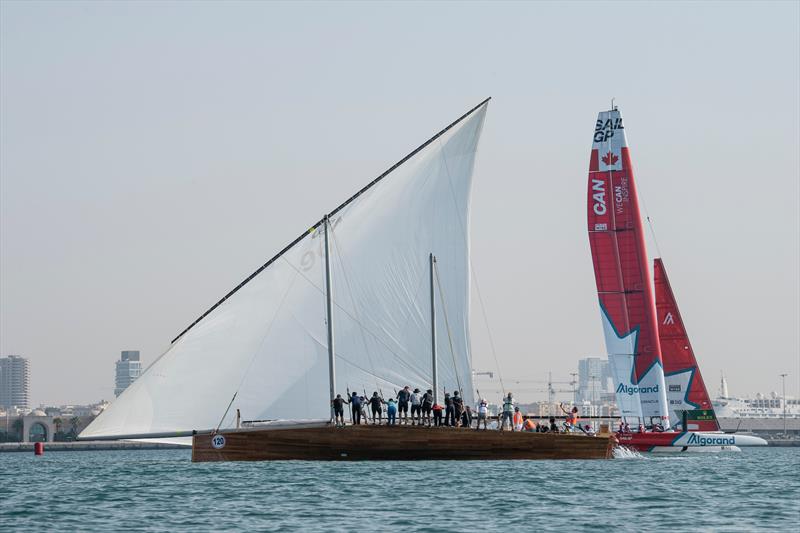 Canada SailGP team F50 sailing past a traditional sailing dhow during a demonstration event ahead of the Dubai Sail Grand Prix presented by P&O Marinas in Dubai, United Arab Emirates photo copyright Ricardo Pinto for SailGP taken at  and featuring the Dhow class