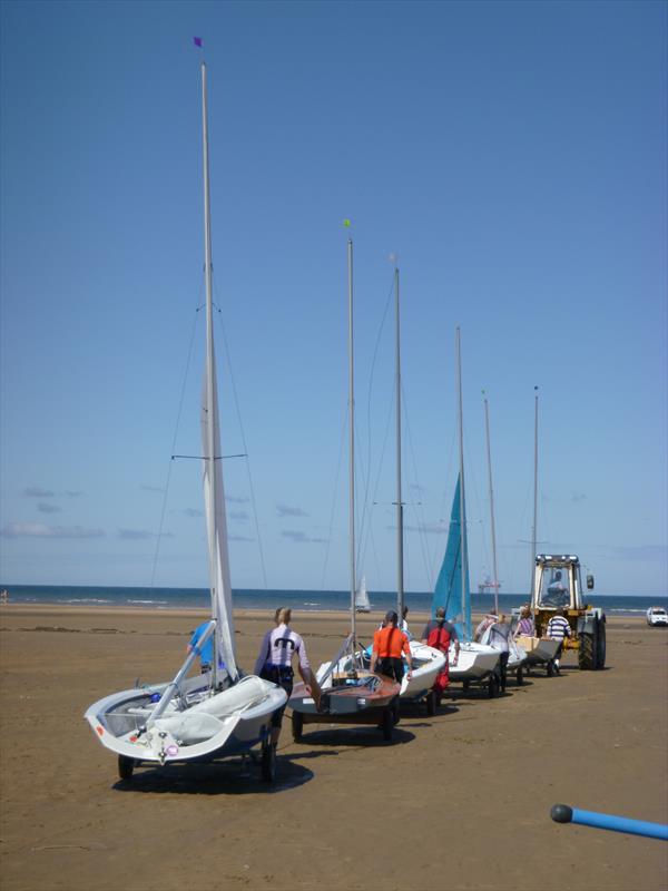 Taking the boats to the water by tractor power during the West Lancashire Yacht Club Tidal Regatta photo copyright M Dorr taken at West Lancashire Yacht Club and featuring the Dinghy class