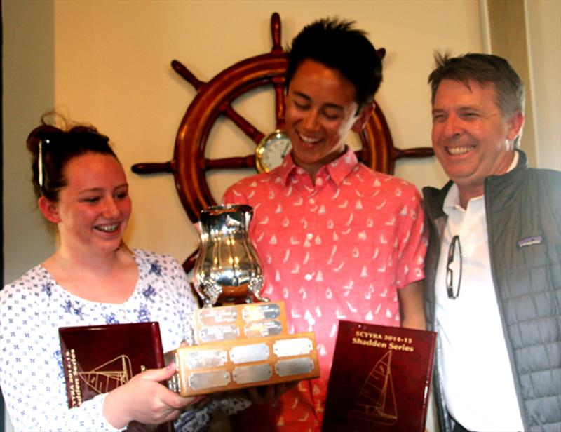 Joseph Hou and crew Skylar Jacobsen admire their Shadden Series trophy with namesake John Shadden photo copyright Rich Roberts taken at Alamitos Bay Yacht Club and featuring the Dinghy class