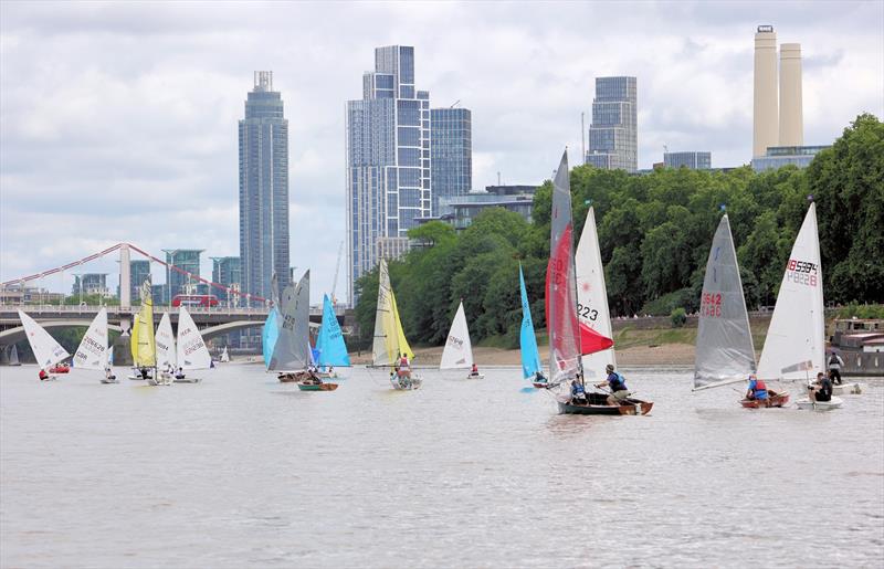 Tideway Dinghy Derby - The fleet approaching Chelsea Bridge with Battersea Power Station to the right - photo © Mark Jardine