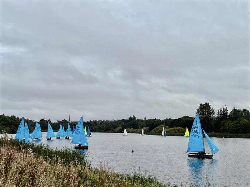 Neal and Ellen Piper leading from Charles Morrish and Alison Robertson Morrish in race 4 of the Enterprise Scottish Bluebell Series at Forfar photo copyright Helen Wiles taken at Forfar Sailing Club and featuring the Enterprise class