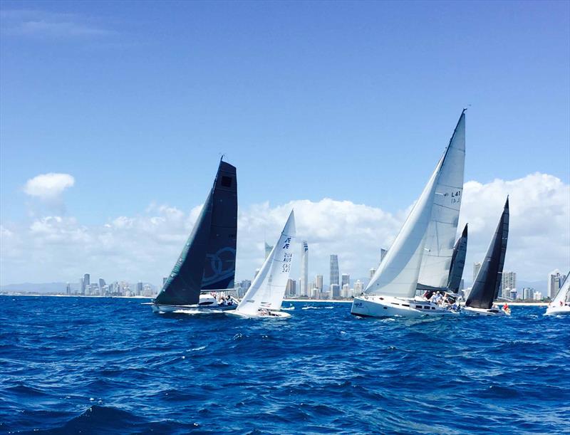 Wayne Kirby's Etchells, Grape Juice taking on David Chadkirk's 50ft, Cyclone on the start line of PHS Division 1 on day one at SYC's Bartercard Sail Paradise Regatta photo copyright SYC taken at  and featuring the Etchells class