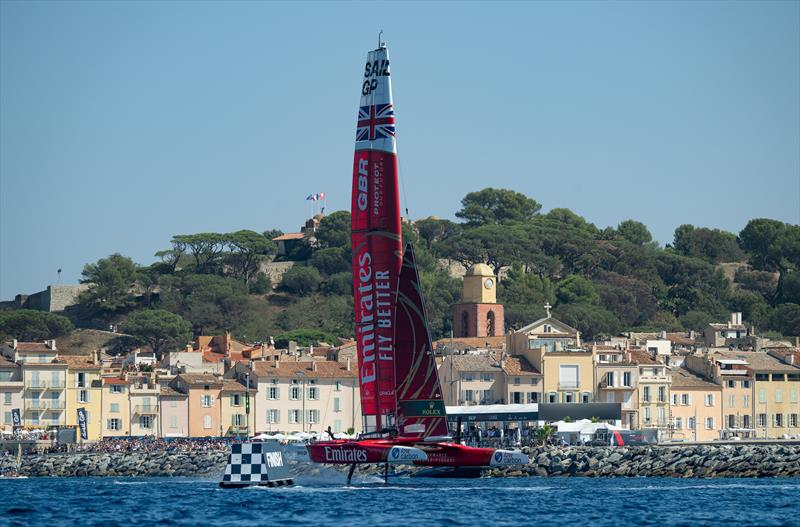 Emirates Great Britain SailGP Team helmed by Ben Ainslie cross the finish line as they sail past the bell tower and old town of Saint-Tropez on Race Day 2 of the France Sail Grand Prix in Saint-Tropez, France photo copyright Ricardo Pinto for SailGP taken at  and featuring the F50 class