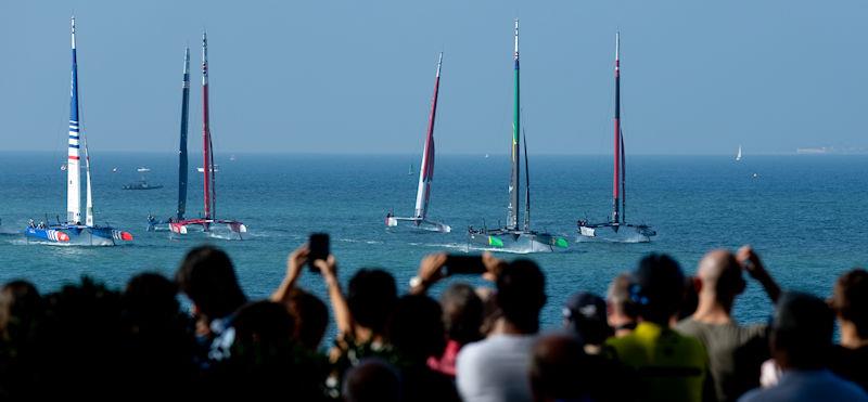 Spectators gather on the seawall as SailGP fleet pass on Race Day 1 of the Spain Sail Grand Prix in Cadiz, Spain photo copyright Jed Leicester for SailGP taken at  and featuring the F50 class