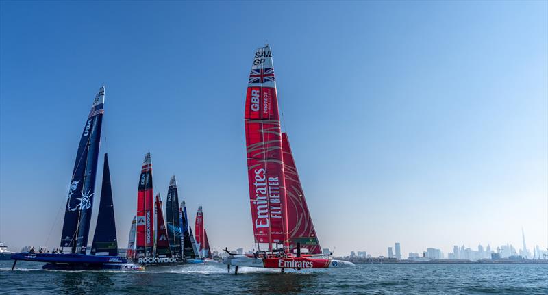 Emirates Great Britain SailGP Team are disqualified after a close encounter with the USA SailGP Team as the fleet cross the start line on Race Day 2 of the Emirates Sail Grand Prix presented by P&O Marinas in Dubai, United Arab Emirates photo copyright Bob Martin for SailGP taken at  and featuring the F50 class