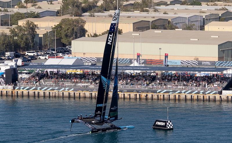 New Zealand SailGP Team crosses the finish line as it passes the grandstand in the SailGP Race Stadium on Race Day 2 of the Mubadala Abu Dhabi Sail Grand Prix  - January 14 photo copyright Simon Bruty/SailGP taken at Abu Dhabi Marine Sports Club and featuring the F50 class