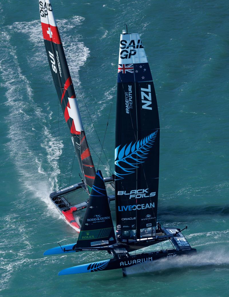 New Zealand SailGP Team helmed by Peter Burling sails in front of Switzerland SailGP Team helmed by Nathan Outteridge on Race Day 2 of the ITM New Zealand Sail Grand Prix in Christchurch, New Zealand photo copyright Felix Diemer for SailGP taken at  and featuring the F50 class