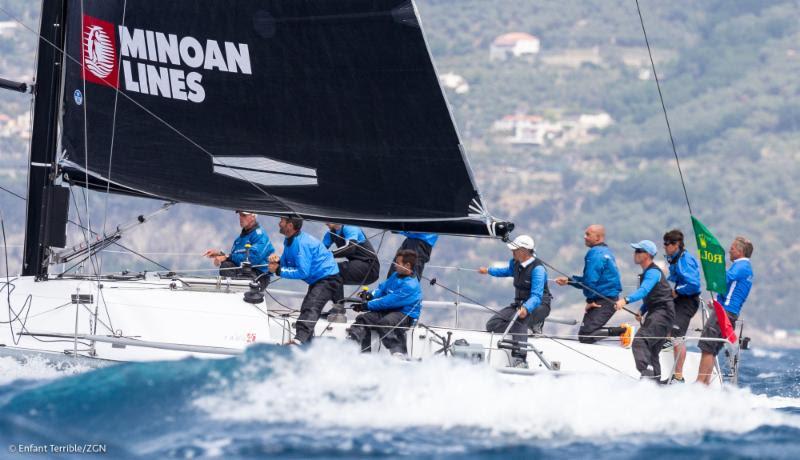 Skipper Alberto Rossi, holding tiller, has Enfant Terrible atop the leader board after two days of racing at Rolex Capri Sailing Week photo copyright Farr 40 / ZGN taken at Yacht Club Capri and featuring the Farr 40 class