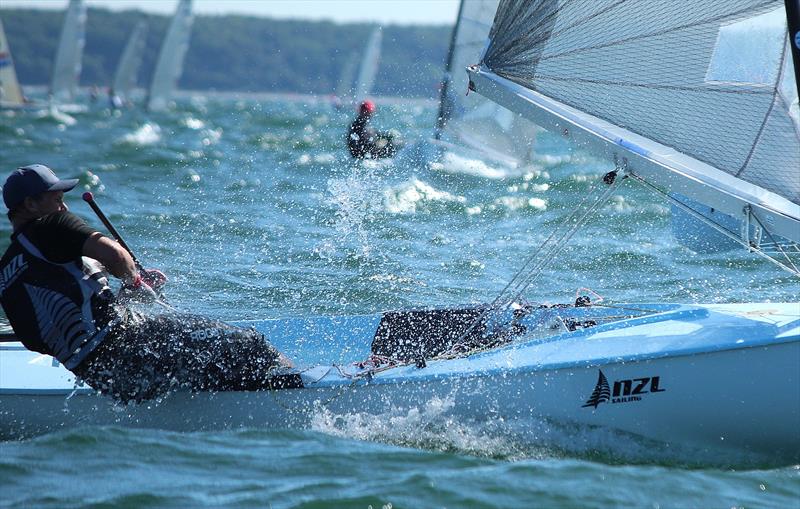 Josh Junior in action in New Zealand photo copyright Robert Deaves taken at  and featuring the Finn class