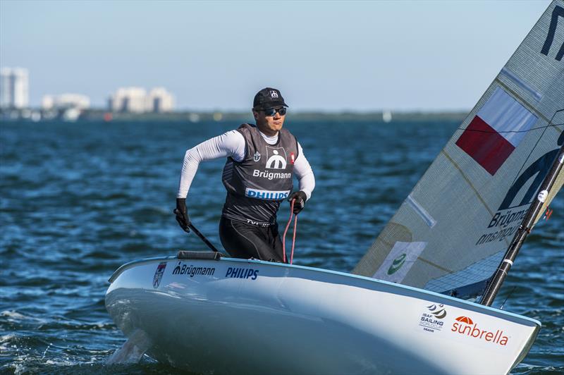 Piotr Kula on day 2 of ISAF Sailing World Cup Miami photo copyright Walter Cooper / US Sailin taken at Coconut Grove Sailing Club and featuring the Finn class