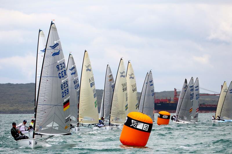 Philip Kasüske leads a group round the top mark on day 2 of the Finn Gold Cup in New Zealand photo copyright Robert Deaves taken at Takapuna Boating Club and featuring the Finn class