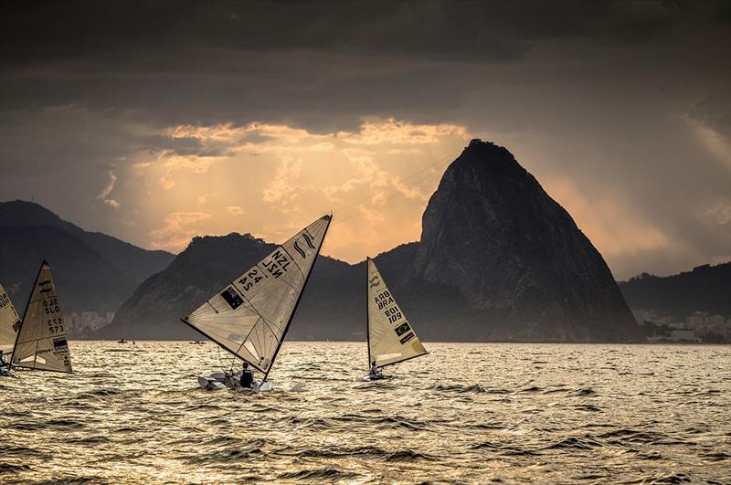 Sunset Finn sailing at the 2015 Aquece Rio Test Event photo copyright Jesus Renedo / Sailing Energy / World Sailing taken at  and featuring the Finn class