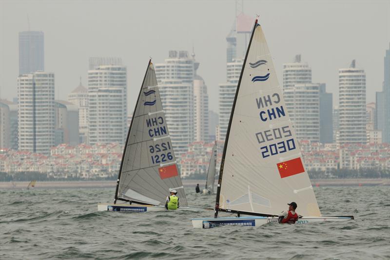 Finns on Sailing World Cup Qingdao day 3 photo copyright Daniel Smith taken at  and featuring the Finn class