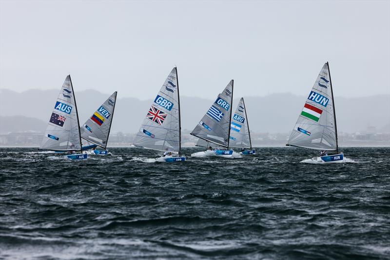 Finn fleet downwind on Tokyo 2020 Olympic Sailing Competition Day 3 photo copyright Sailing Energy / World Sailing taken at  and featuring the Finn class