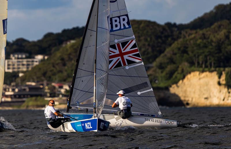 Josh Junior (NZL) crossed Giles Scott (GBR) on Tokyo 2020 Olympic Sailing Competition Day 3 - photo © Sailing Energy / World Sailing