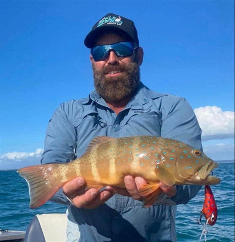 A man's gotta troll when a man's gotta troll. Luke with another victim of his faved Grumpy Lures Trout Candy photo copyright Fisho's Tackle World taken at  and featuring the Fishing boat class