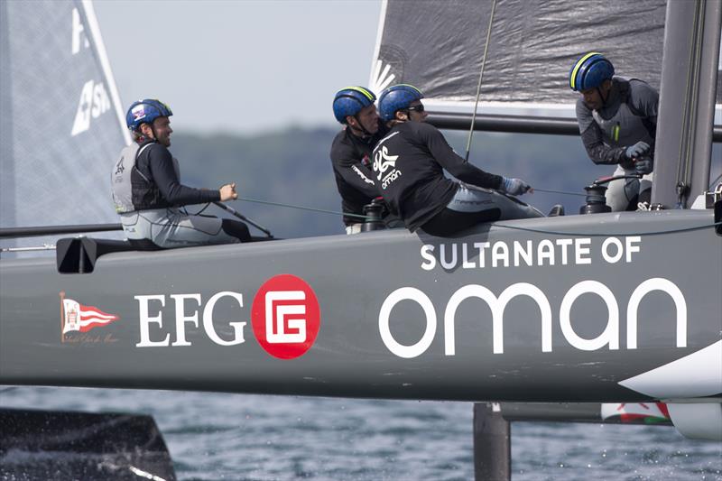 Sultanate of Oman skipper Leigh McMillan dislocated his finger on day 2 of GC32 Cowes Cup photo copyright Sander van der Borch / Bullitt GC32 Racing Tou taken at  and featuring the GC32 class