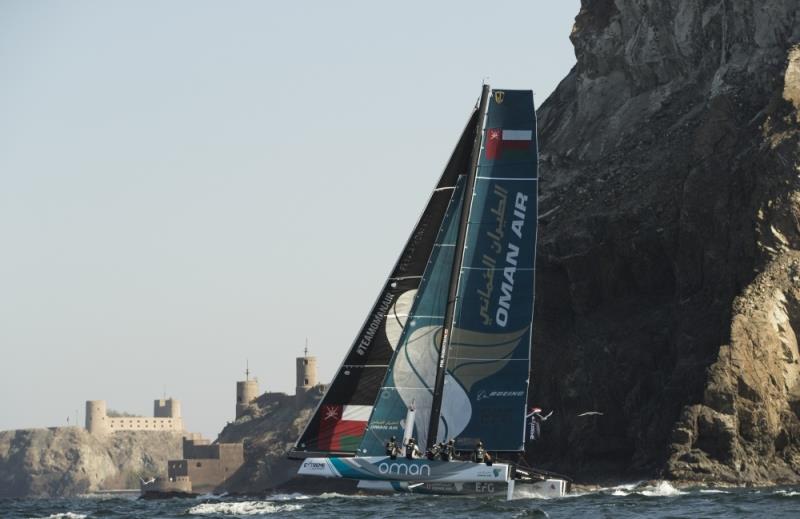 Extreme Sailing Series 2017. Muscat. Oman. The fleet racing close to the shore and historic town of Mutrah photo copyright Lloyd Images taken at Oman Sail and featuring the GC32 class