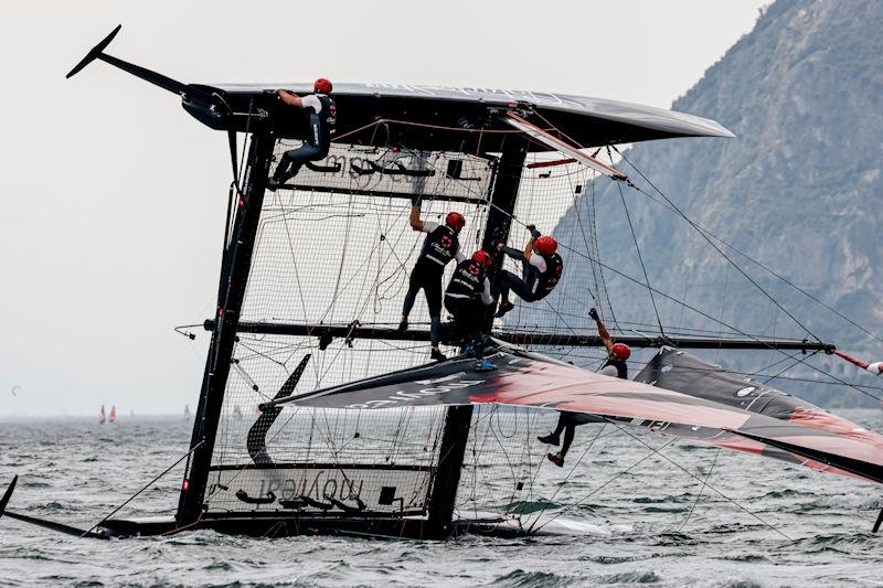 Black Star Sailing Team suffered a capsize in today's second race on day 1 of the GC32 Riva Cup photo copyright Sailing Energy / GC32 Racing Tour taken at Fraglia Vela Riva and featuring the GC32 class