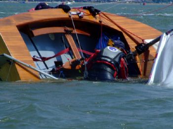 A capsize during the Piplers of Poole GP14 Southerns